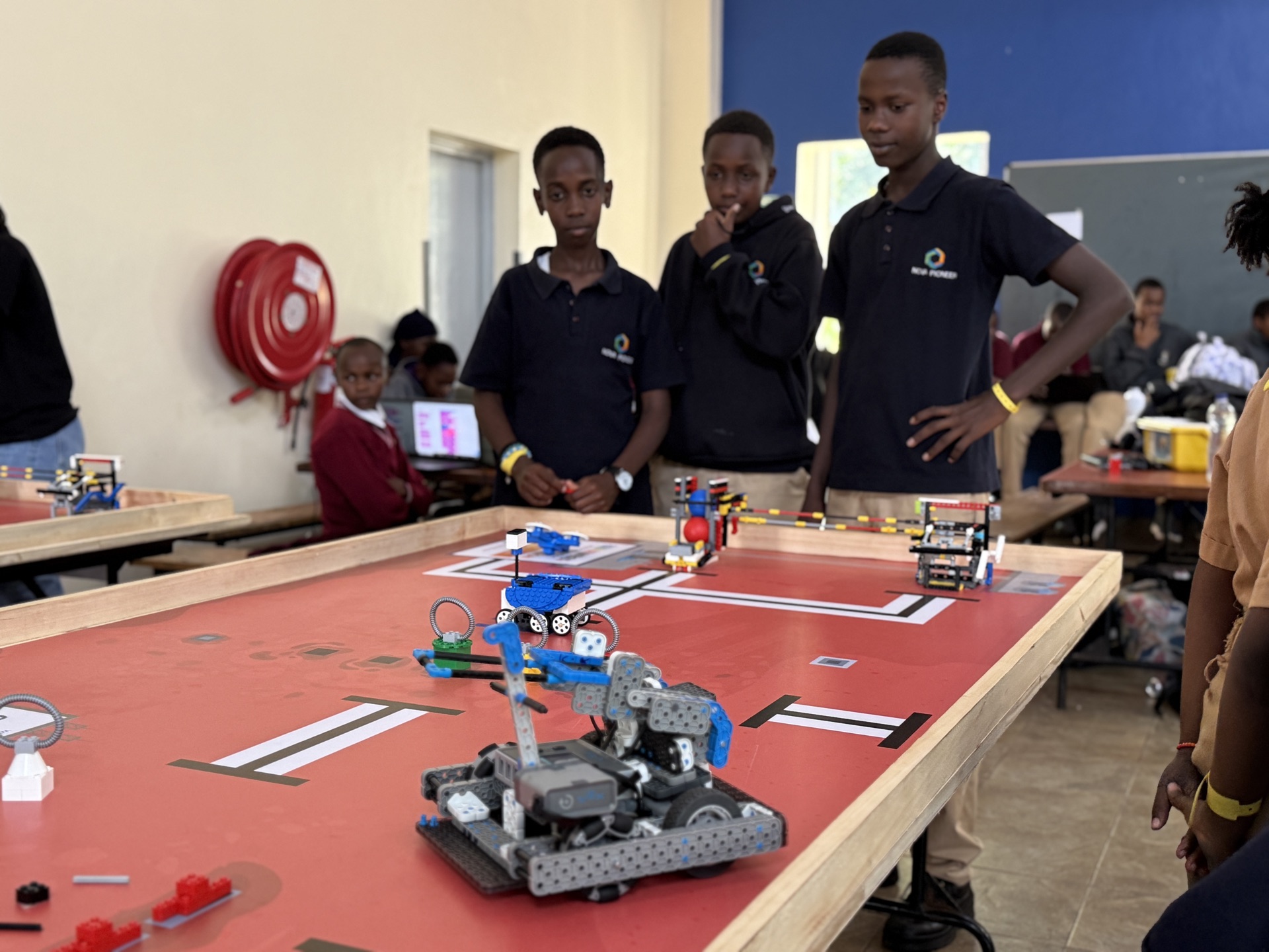Boys observing robots