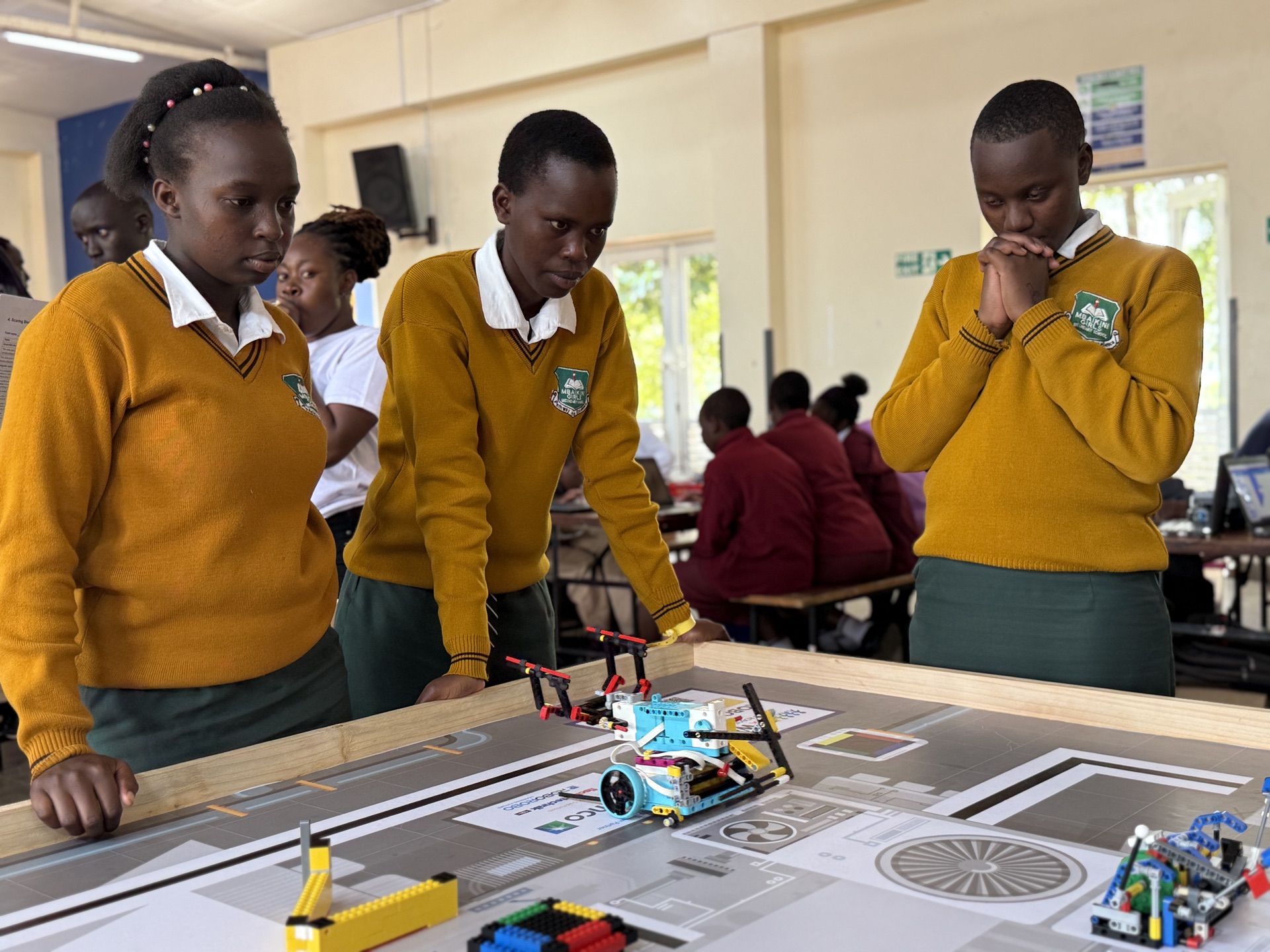 Girls watching robot perform